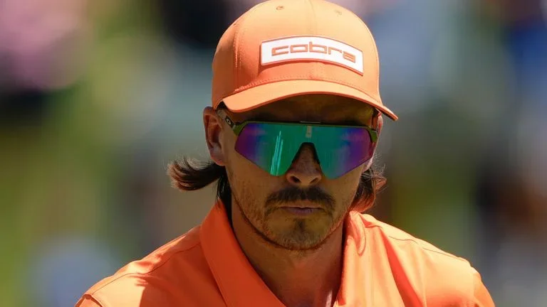 Rickie Fowler waves after a birdie on the second hole during final round of the Truist Championship golf tournament at the Quail Hollow Club